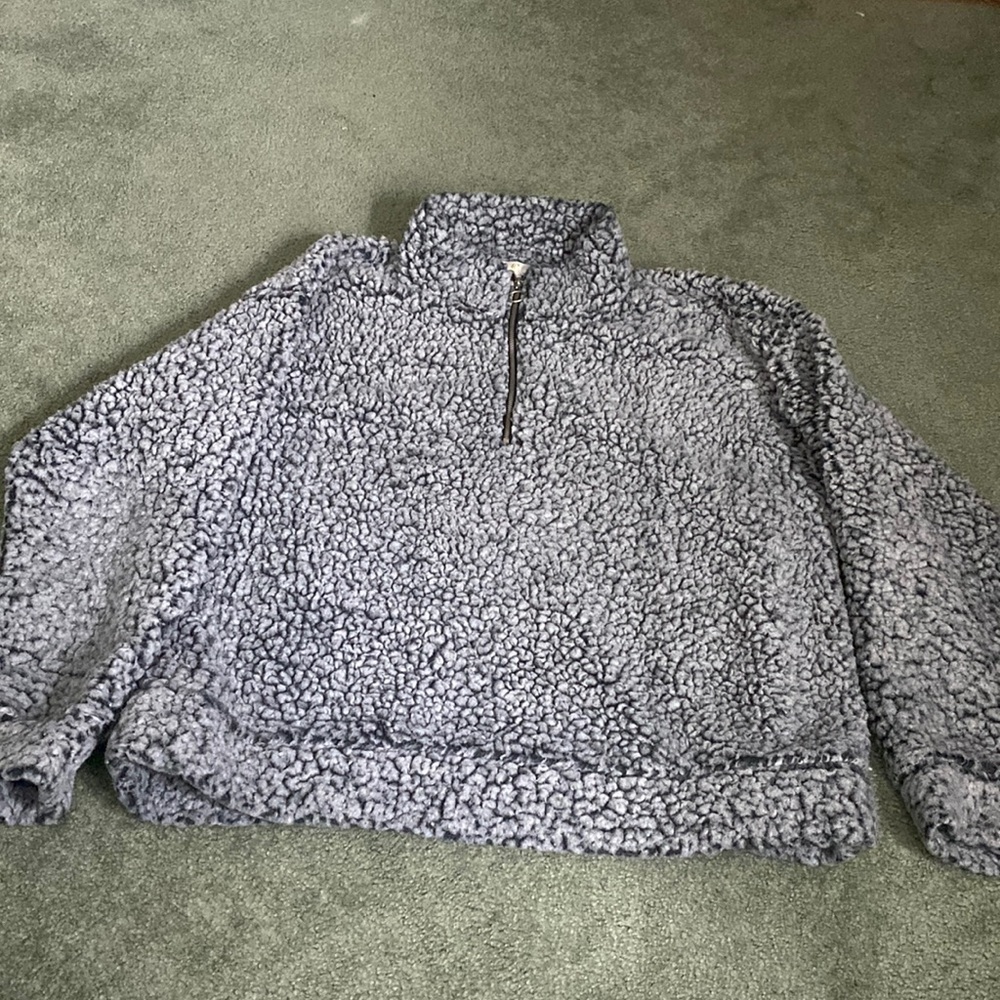 black and grey sweater.
